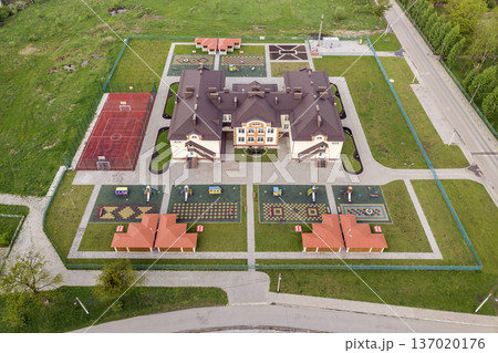 Aerial view of new prescool building in residential rural area. Aerial view of new prescool building in residential rural area. 137020176