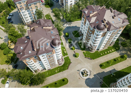 Top view of apartment or office tall buildings, parked cars, urban city landscape. Drone aerial photography. 137020450