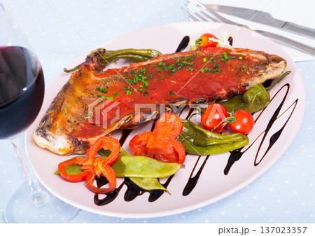 Lamb ribs baked with spicy tomato sauce with red wine 137023357