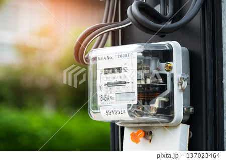 Electric measuring power meter for energy cost at home and office, solar cell concept. Electric measuring power meter for energy cost at home and office, solar cell concept. 137023464