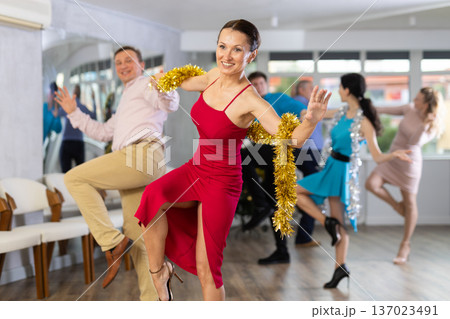 Paso doble dance during Christmas or New Year celebrations in dance studio Paso doble dance during Christmas or New Year celebrations in dance studio 137023491