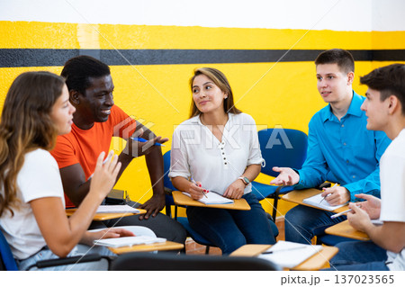 Men and women chatting in conversation club Men and women chatting in conversation club 137023565