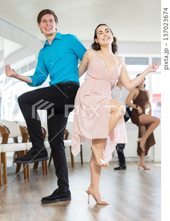 Couple young woman and man dancing twist 137023674