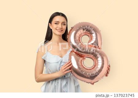 Woman with balloon is celebrating International Women's Day 137023745