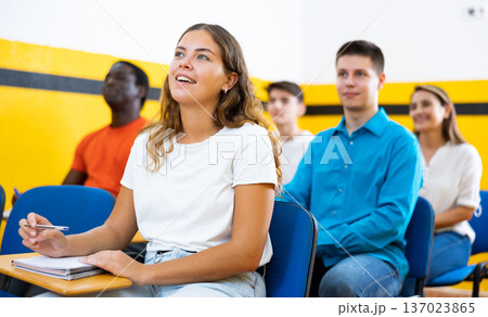 Young woman attending lecture in taxi training school Young woman attending lecture in taxi training school 137023865