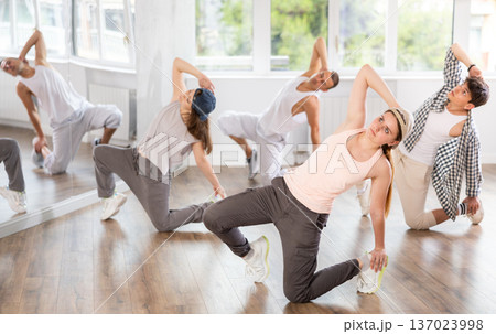 Young girl practicing breakdance in training hall Young girl practicing breakdance in training hall 137023998