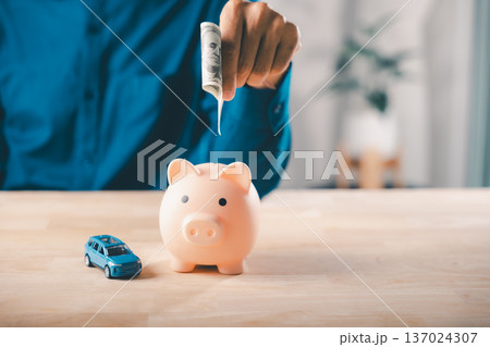 Car insurance saving with piggy bank money, save fuel cost, auto gas price, finance and tax budget help manage monthly vehicle expenses for road trips across country and city Car insurance saving with piggy bank money, save fuel cost, auto gas price, finance and tax budget help manage monthly vehicle expenses for road trips across country and city 137024307