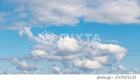 Blue sky background with white clouds. Sky clouds in sunny day 137025235