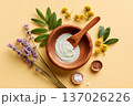 Herbal skincare cream facial mask in wooden bowl with botanicals. Organic cosmetic care and wellness styling. Skincare branding, spa marketing, clean beauty, treatment and natural product advertising. 137026226