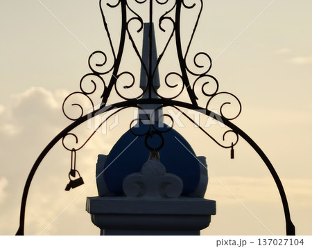 Elegant sunset bell silhouette, Charming coastal architecture with artistic bell and domed features Elegant sunset bell silhouette, Charming coastal architecture with artistic bell and domed features 137027104