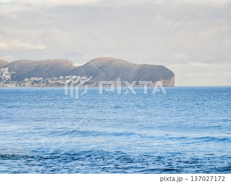 Peaceful seaside landscape for relaxation, Quiet ocean view with peaceful village and gentle waves Peaceful seaside landscape for relaxation, Quiet ocean view with peaceful village and gentle waves 137027172