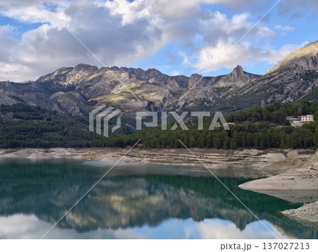 Peaceful home on tranquil waters, Quiet countryside dwelling nestled near shimmering emerald lake Peaceful home on tranquil waters, Quiet countryside dwelling nestled near shimmering emerald lake 137027213