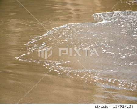Foamy waves gently touch shores, Minimalist seaside design reflects tranquility and wellness themes 137027233