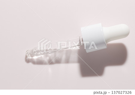 Liquid cosmetic product for the skin or medicine in a pipette. Copy space Liquid cosmetic product for the skin or medicine in a pipette. Copy space 137027326