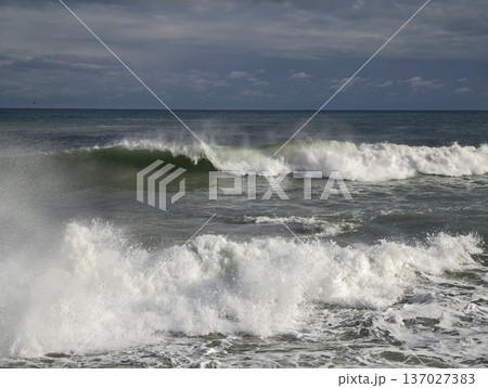 Chaotic storm sea, Fierce ocean turmoil captured through crashing waves and turbulent weather Chaotic storm sea, Fierce ocean turmoil captured through crashing waves and turbulent weather 137027383