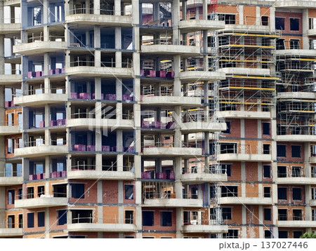 Bustling highrise with decorative laundry and household items showcasing urban community life Bustling highrise with decorative laundry and household items showcasing urban community life 137027446