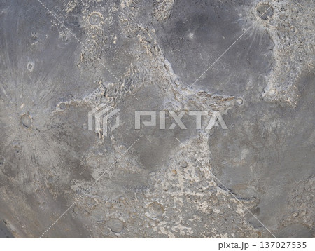 Highcontrast closeup of cratered moon surface exhibiting rough texture and shadows for visual research Highcontrast closeup of cratered moon surface exhibiting rough texture and shadows for visual research 137027535