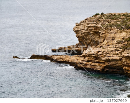 Rocky coastal landscape, Stony seaside escarpment intersecting turbulent waters offers research opportunity Rocky coastal landscape, Stony seaside escarpment intersecting turbulent waters offers research opportunity 137027669