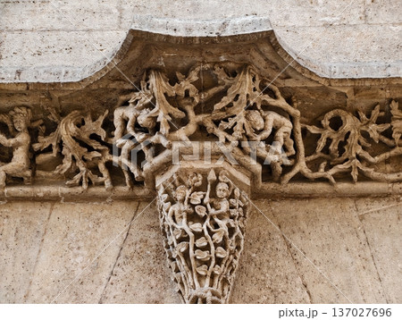 Decorative carved stone capital showcasing intricate foliage and artistic craftsmanship details 137027696