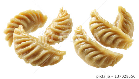 Set of Steamed Banana dumplings with intricate twisted edges, isolated on white background. Concept of Asian cuisine and food art Set of Steamed Banana dumplings with intricate twisted edges, isolated on white background. Concept of Asian cuisine and food art 137029350