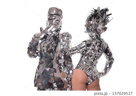 Dancers in silver costumes showcase a vibrant performance at a festive event Dancers in silver costumes showcase a vibrant performance at a festive event 137029517
