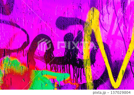 Colorful urban graffiti wall with neon pink, yellow, green spray paint texture in 90s, Y2K street style 137029804