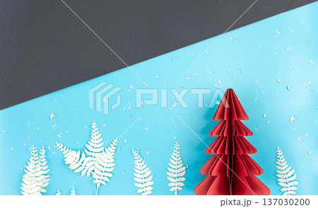 Christmas background with origami paper tree on paper background, flat lay. Christmas background with origami paper tree on paper background, flat lay. 137030200