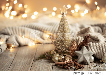 Christmas composition with decor details on blurred background with bokeh. Christmas composition with decor details on blurred background with bokeh. 137030255