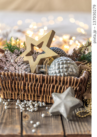 Christmas decorations in a basket. Composition with Christmas decorations. 137030279