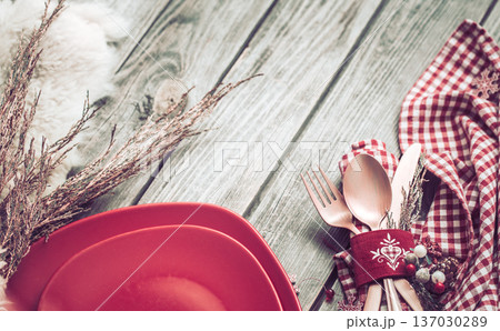 Christmas dinner cutlery with decor on a wooden background 137030289