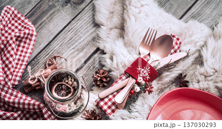 Christmas dinner cutlery with decor on a wooden background 137030293