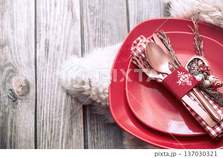 Christmas dinner cutlery with decor on a wooden background 137030321