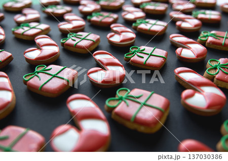 Christmas gingerbread covered with multi-colored icing, close-up. Christmas gingerbread covered with multi-colored icing, close-up. 137030386