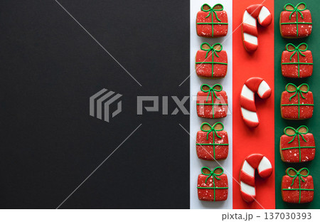 Christmas handmade gingerbread cookies covered with colorful icing, flat lay. 137030393