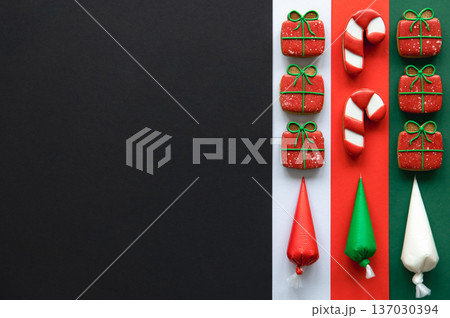Christmas handmade gingerbread cookies covered with colorful icing, flat lay. 137030394