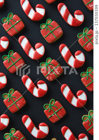 Christmas handmade gingerbread cookies covered with multi-colored icing. 137030399