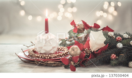 Christmas holiday background with a candle in a candlestick. Christmas holiday background with a candle in a candlestick. 137030404