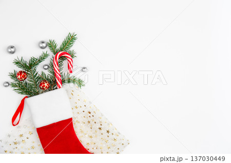 Christmas sock with decorative details on white background, copy space. Christmas sock with decorative details on white background, copy space. 137030449