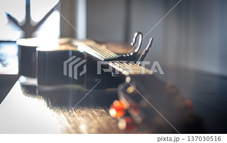 Close-up of an acoustic guitar on a blurred background. Close-up of an acoustic guitar on a blurred background. 137030516
