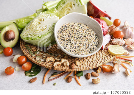 Close-up, a bowl of chia seeds and other healthy foods on the kitchen table. Close-up, a bowl of chia seeds and other healthy foods on the kitchen table. 137030558