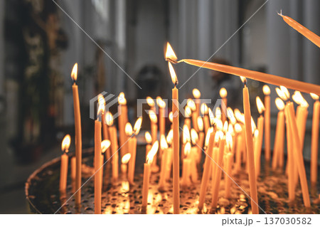 Close-up, candles in the temple on a blurred background. Close-up, candles in the temple on a blurred background. 137030582