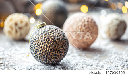 Festive background with Christmas balls and blurred bokeh lights. Festive background with Christmas balls and blurred bokeh lights. 137030596