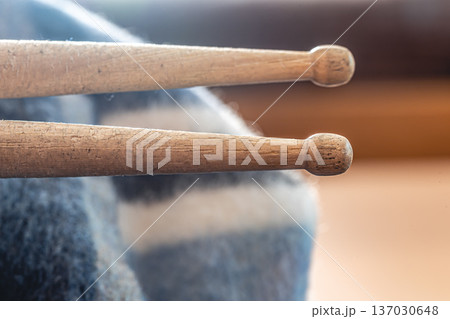 Close-up, drumsticks on a blurred background. Close-up, drumsticks on a blurred background. 137030648