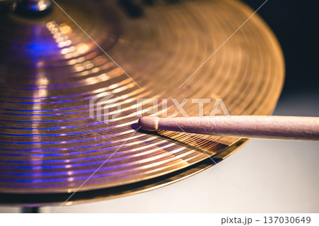 Close-up of drumsticks on a cymbal drum. 137030649