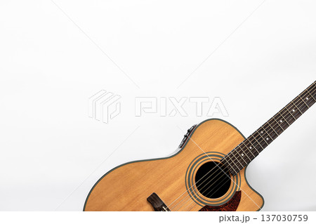 Acoustic guitar on a white background, top view, copy space. 137030759