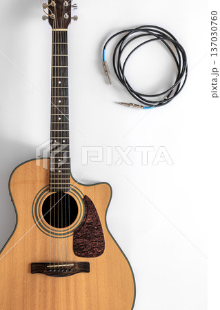 Acoustic guitar on a white background, top view, copy space. 137030760