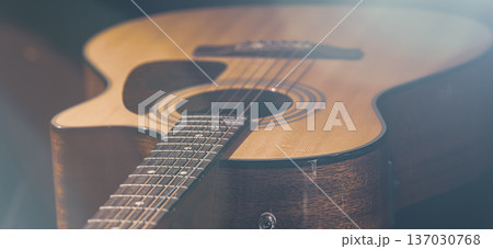 Close-up of a classical acoustic guitar on a black background. Close-up of a classical acoustic guitar on a black background. 137030768