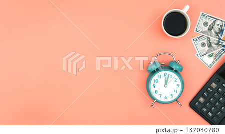 Alarm clock, dollar bills and a cup of coffee, flat lay. Alarm clock, dollar bills and a cup of coffee, flat lay. 137030780