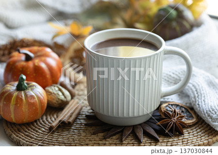 Autumn composition with a cup of hot drink close-up. 137030844
