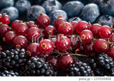 Background from a mix of different berries, macro photography. Background from a mix of different berries, macro photography. 137030908